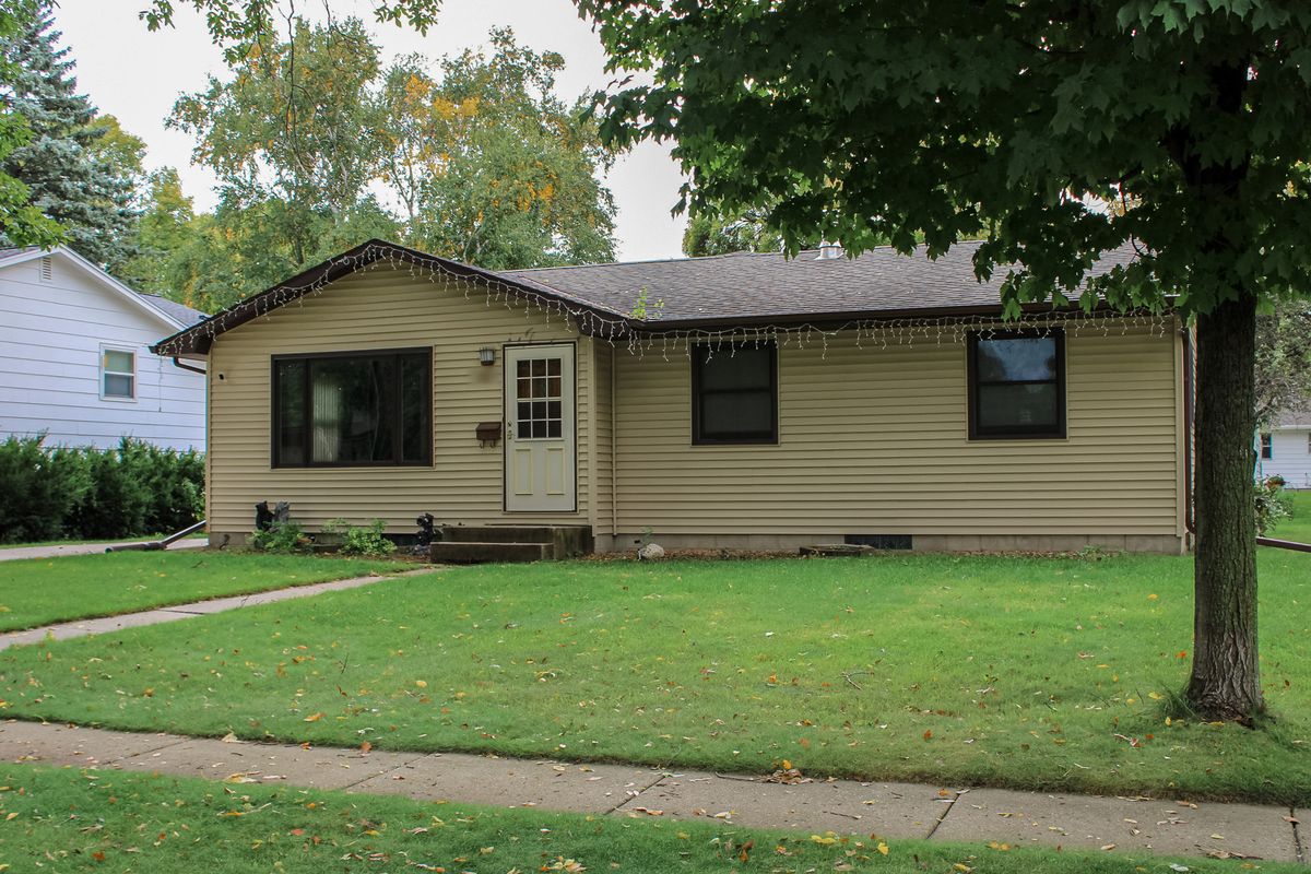 Tan ranch home, front view