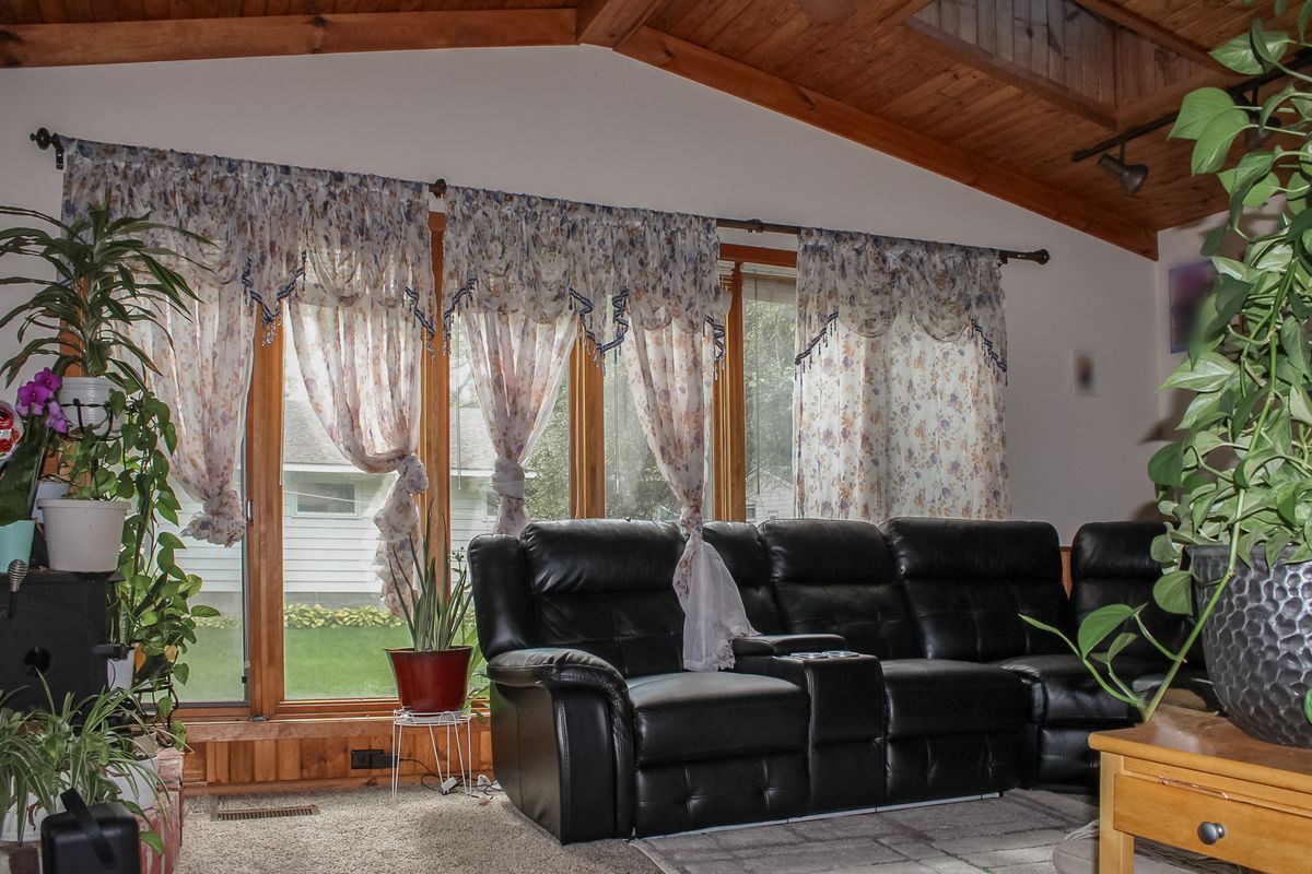 Living room with vaulted wood ceiling
