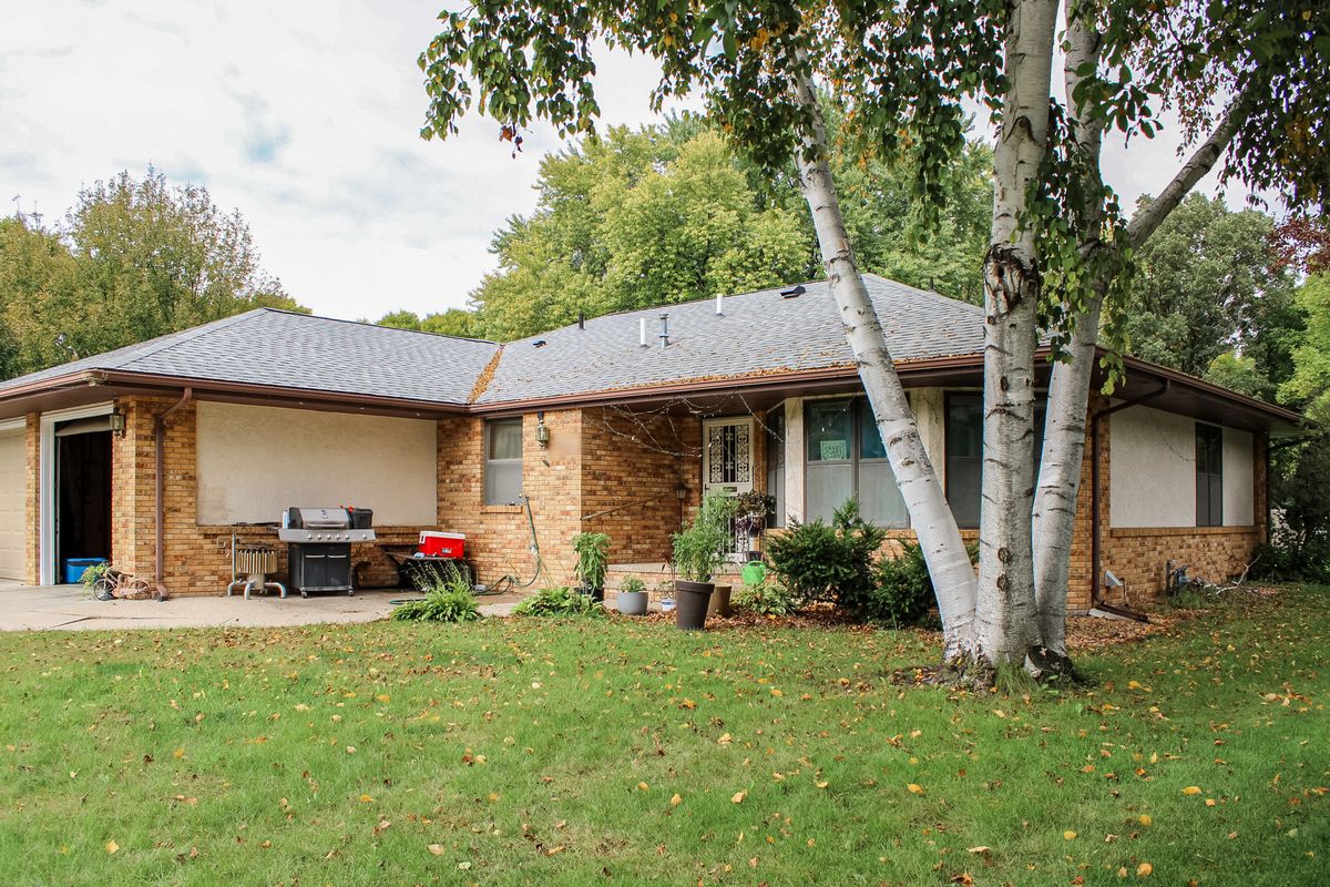 Brick rambler with birch trees